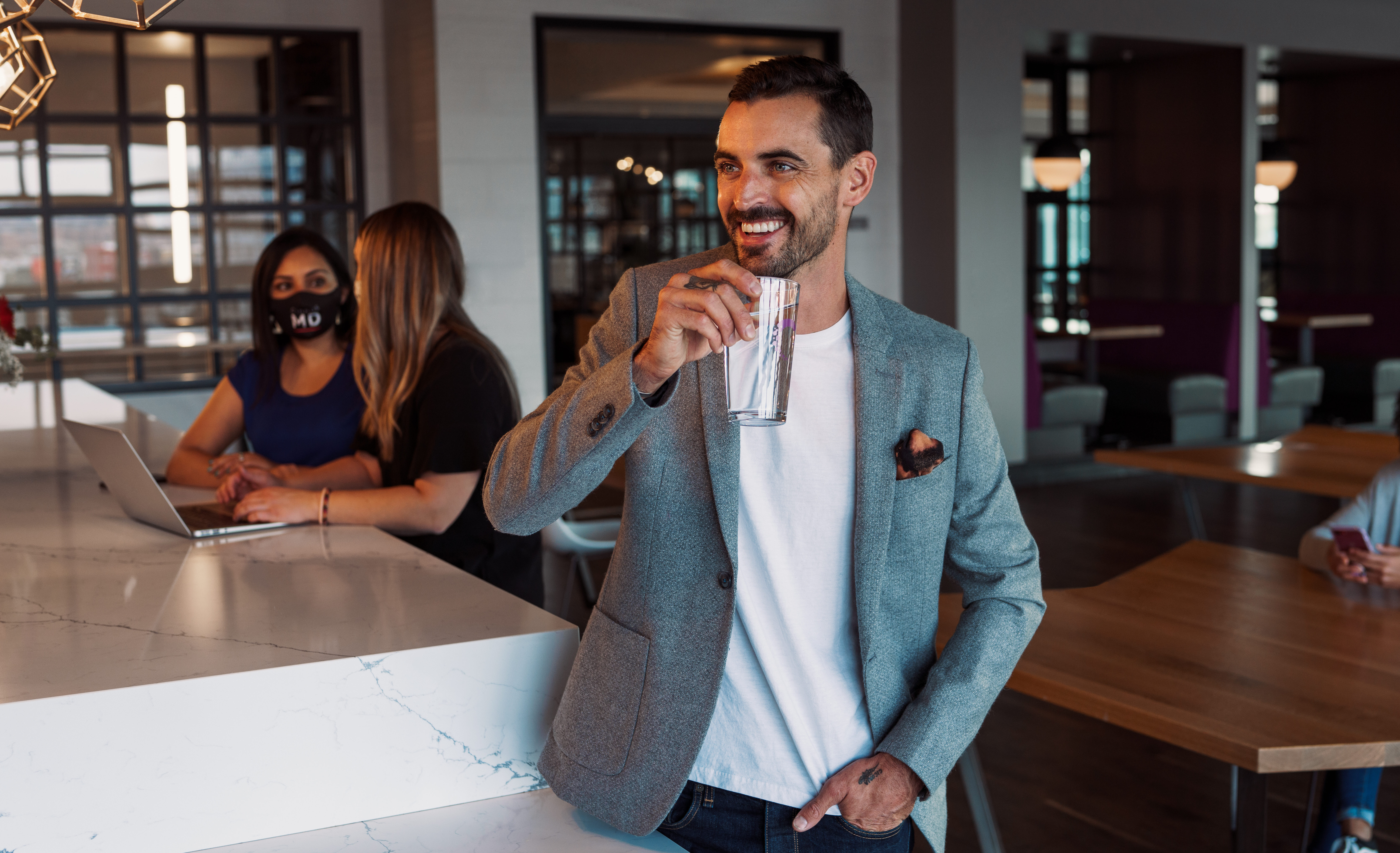 man sipping coffee in coffee shop